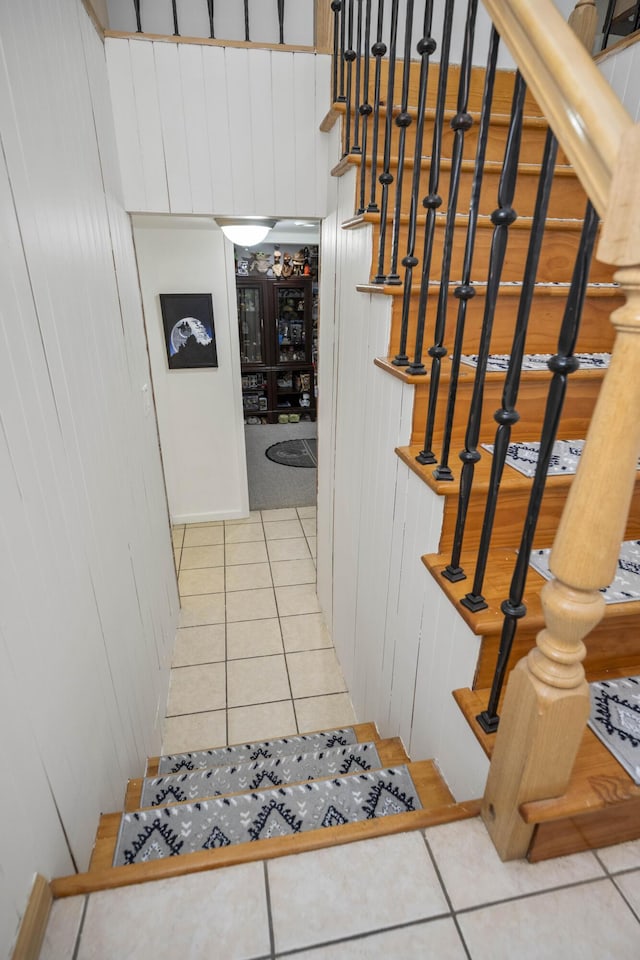 staircase with tile patterned floors