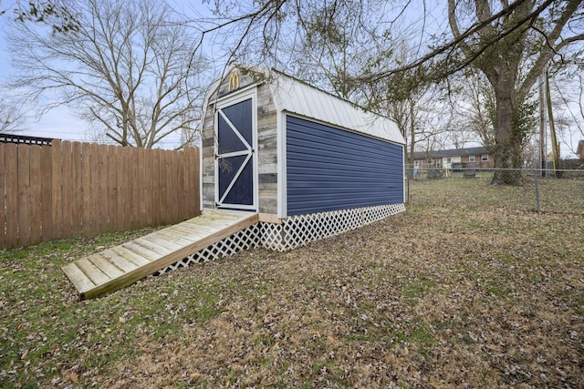 view of shed with a fenced backyard