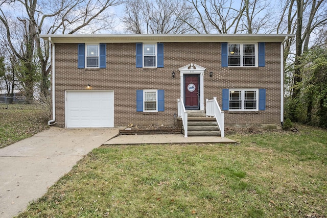 bi-level home featuring a garage, concrete driveway, brick siding, and a front lawn