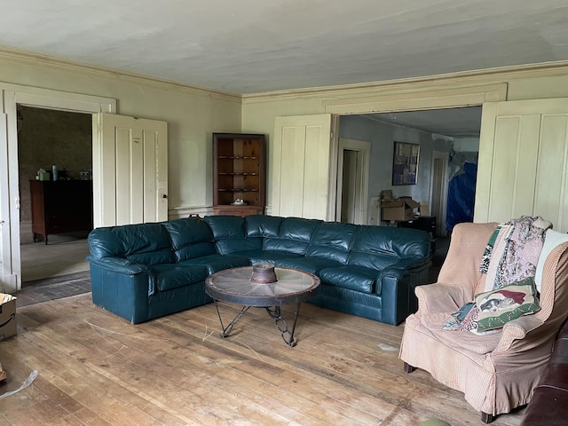 living room featuring hardwood / wood-style floors and ornamental molding