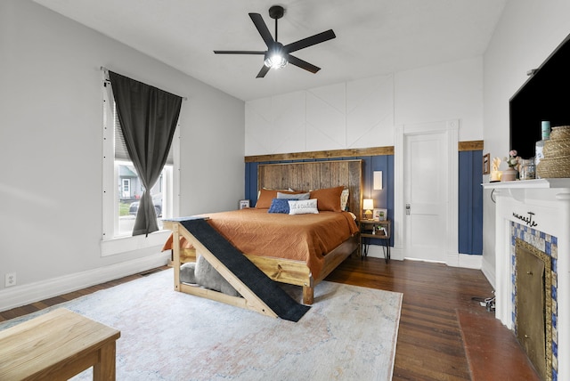 bedroom featuring ceiling fan and dark hardwood / wood-style floors