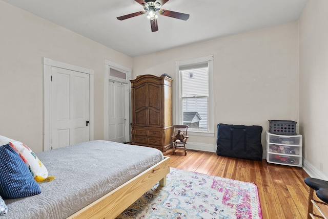 bedroom featuring hardwood / wood-style flooring and ceiling fan