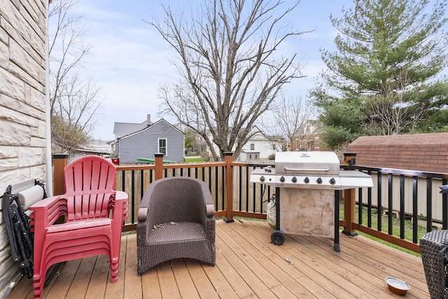 wooden terrace featuring grilling area