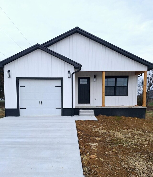 view of front facade with a porch and a garage