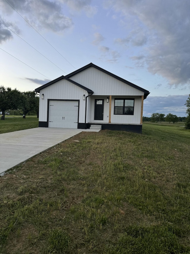 15 David St, Flemingsburg, KY 41041 - modern farmhouse with a front lawn, driveway, and a garage