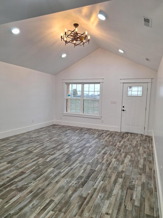 15 David St, Flemingsburg, KY 41041 - unfurnished living room with wood finished floors, plenty of natural light, a chandelier, lofted ceiling, and recessed lighting