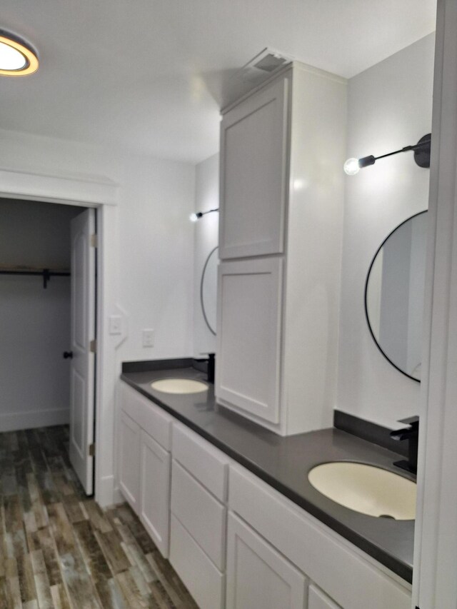 bathroom featuring hardwood / wood-style floors, tiled shower / bath combo, and toilet