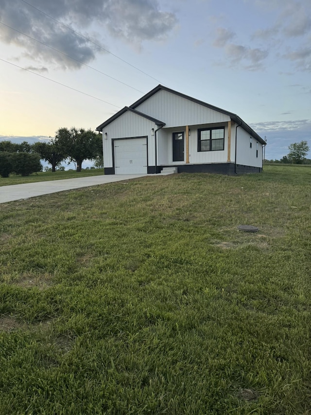 15 David St, Flemingsburg, KY 41041 - modern farmhouse style home featuring concrete driveway, a front yard, and a garage