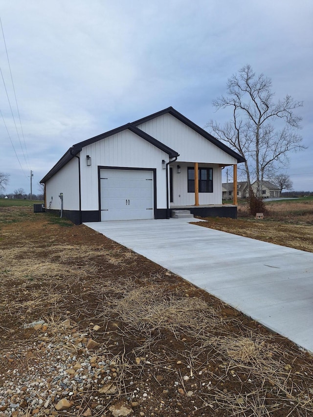 15 David St, Flemingsburg, KY 41041 - modern farmhouse style home featuring concrete driveway, covered porch, and a garage