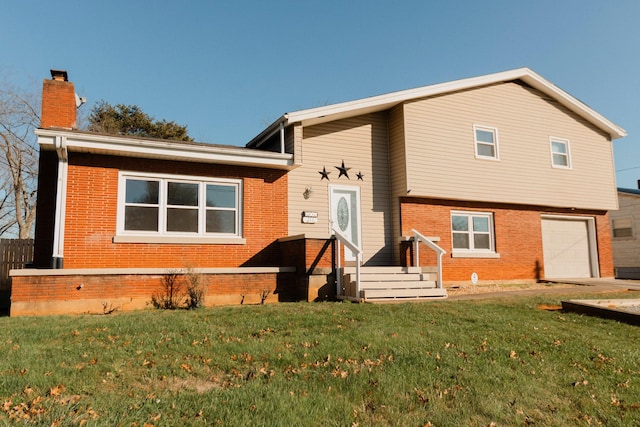 rear view of house with a garage and a yard