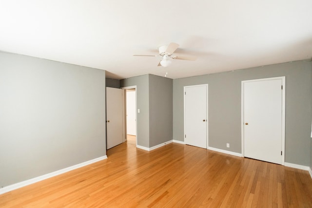 unfurnished bedroom with ceiling fan and light hardwood / wood-style floors