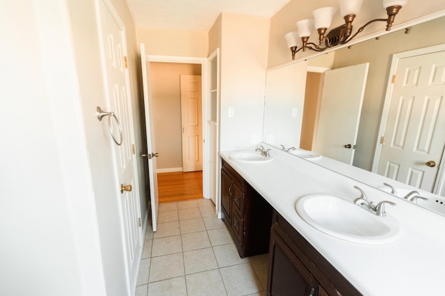 bathroom with tile patterned floors and vanity