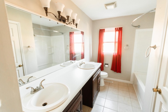 bathroom featuring tile patterned floors, vanity, and toilet