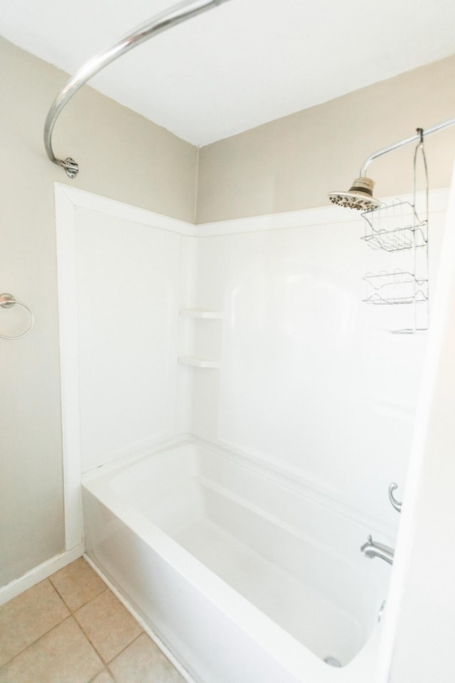 bathroom featuring tile patterned flooring and shower / tub combination