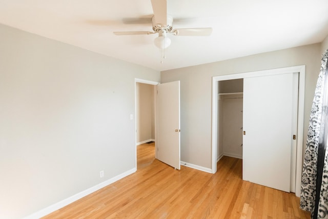 unfurnished bedroom featuring ceiling fan, light hardwood / wood-style floors, and a closet