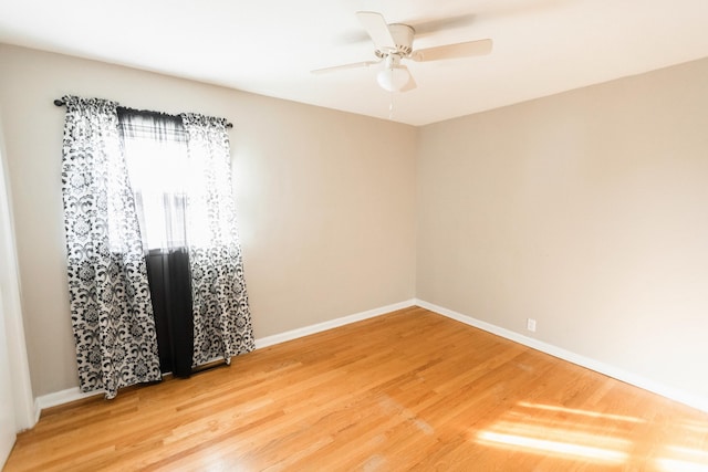 spare room featuring hardwood / wood-style flooring and ceiling fan