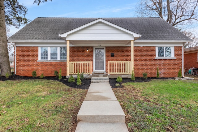 bungalow-style house featuring a front yard and covered porch