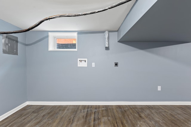 basement with hardwood / wood-style floors and electric panel