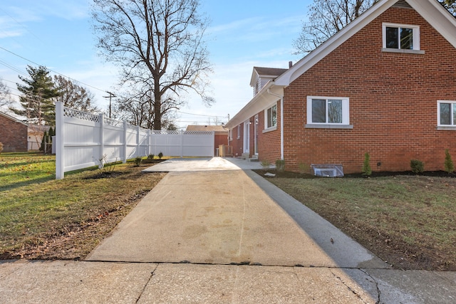 view of home's exterior with a yard