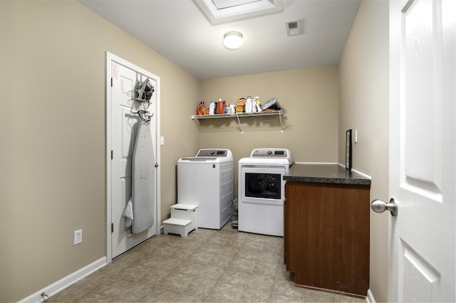 clothes washing area with washing machine and clothes dryer