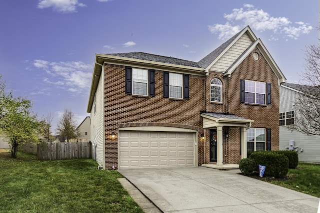 view of front property featuring a garage and a front yard