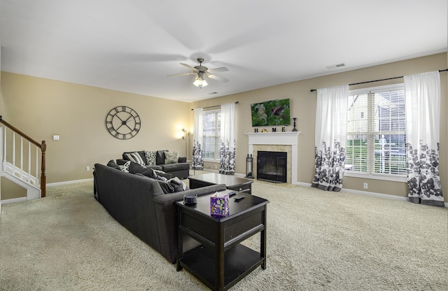 living room featuring ceiling fan, a healthy amount of sunlight, and carpet floors