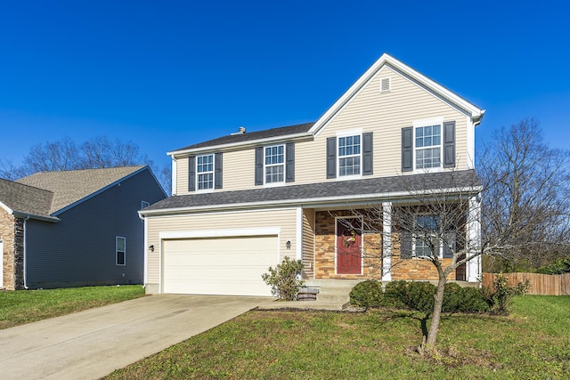 front of property with a garage and a front yard