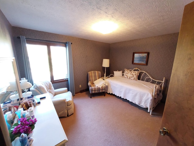 carpeted bedroom with a textured ceiling