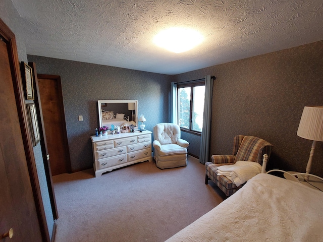 bedroom with carpet flooring and a textured ceiling