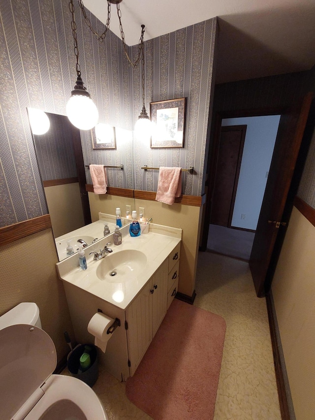 bathroom featuring vanity and toilet