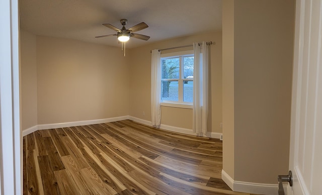 unfurnished room featuring hardwood / wood-style floors and ceiling fan