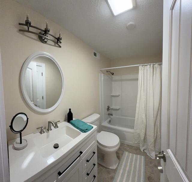 full bathroom with vanity, shower / bath combo, toilet, and a textured ceiling