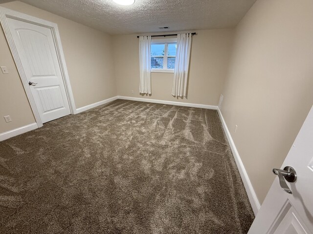 18 Ash Dr, Nancy, KY 42544 - carpeted spare room featuring a textured ceiling and baseboards