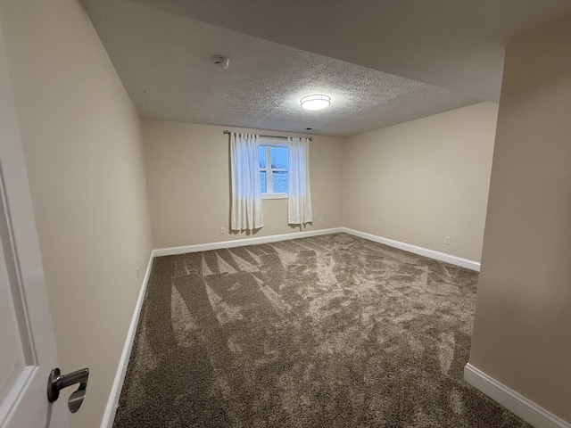 18 Ash Dr, Nancy, KY 42544 - unfurnished room featuring a textured ceiling, baseboards, carpet, and a smoke detector