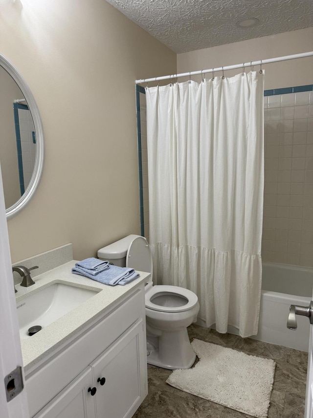 full bathroom with vanity, toilet, a textured ceiling, and shower / bath combo