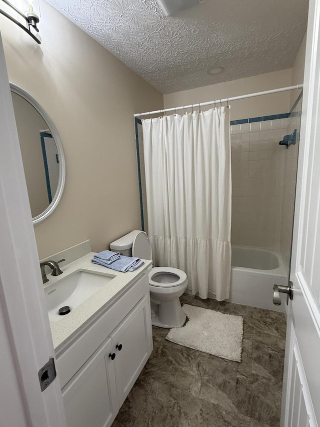 full bathroom with vanity, shower / tub combo, a textured ceiling, and toilet