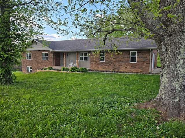 18 Ash Dr, Nancy, KY 42544 - ranch-style home with brick siding, a front lawn, and a shingled roof