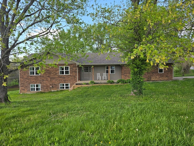 18 Ash Dr, Nancy, KY 42544 - rear view of house with brick siding and a yard