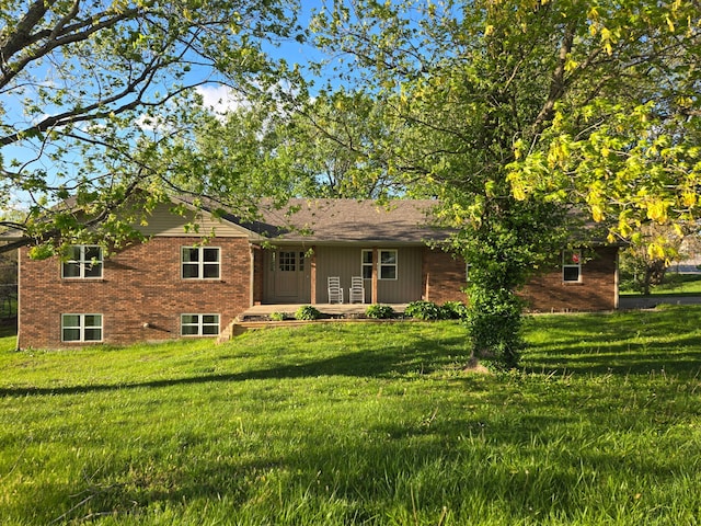 18 Ash Dr, Nancy, KY 42544 - rear view of property with brick siding and a lawn