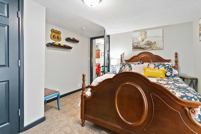 carpeted bedroom with a textured ceiling