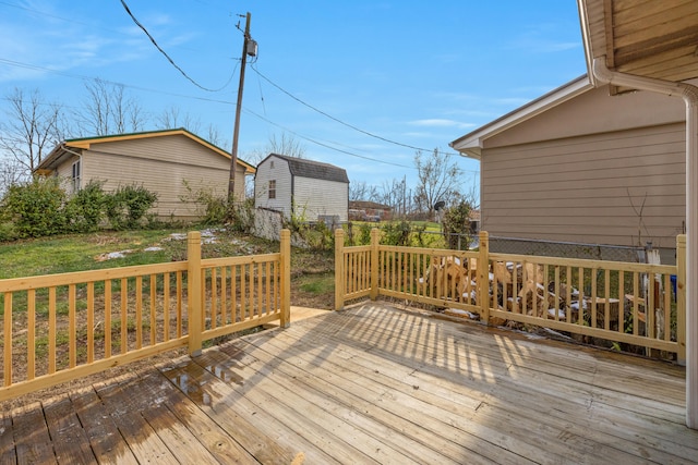 wooden deck with a lawn