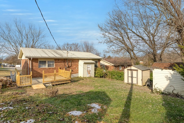 back of property with a yard, a storage shed, and a wooden deck