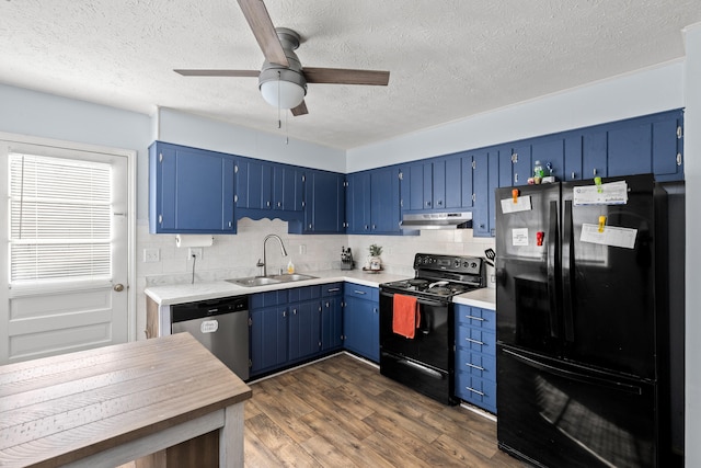 kitchen with blue cabinetry, sink, dark wood-type flooring, and black appliances