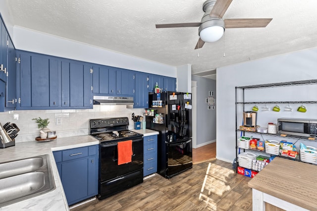 kitchen featuring backsplash, black appliances, dark hardwood / wood-style floors, ceiling fan, and blue cabinetry