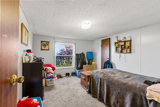 carpeted bedroom with a textured ceiling