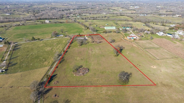 birds eye view of property featuring a rural view