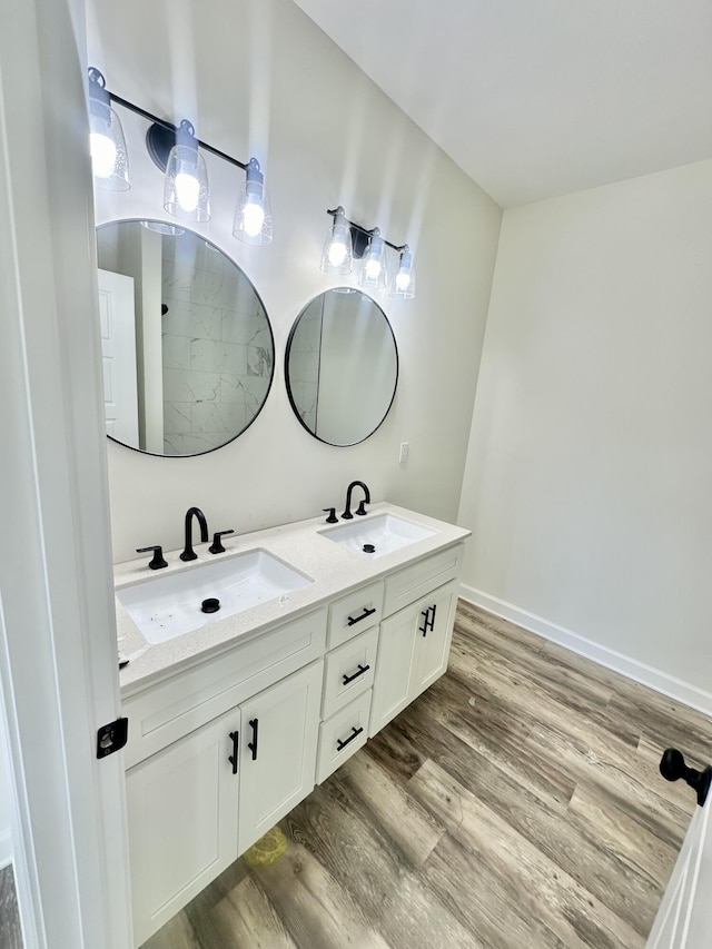 bathroom with wood-type flooring and vanity