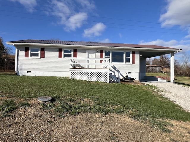 manufactured / mobile home with a carport and a front yard