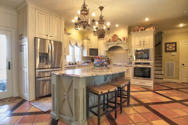 kitchen with recessed lighting, visible vents, ornamental molding, appliances with stainless steel finishes, and backsplash