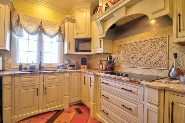 kitchen with decorative backsplash, ornamental molding, custom exhaust hood, black electric stovetop, and a sink